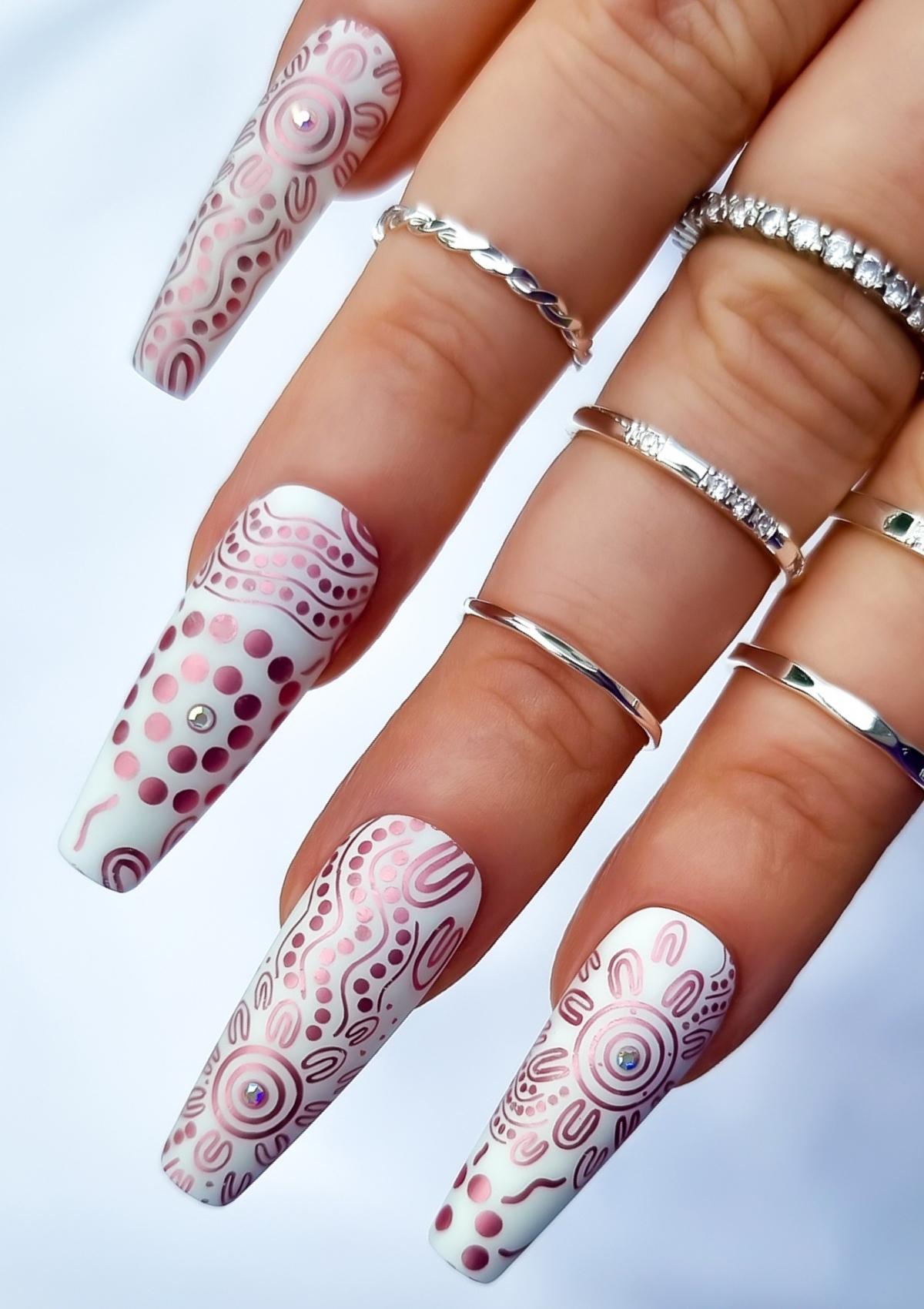 White nails with pink Aboriginal Australian nail art designs