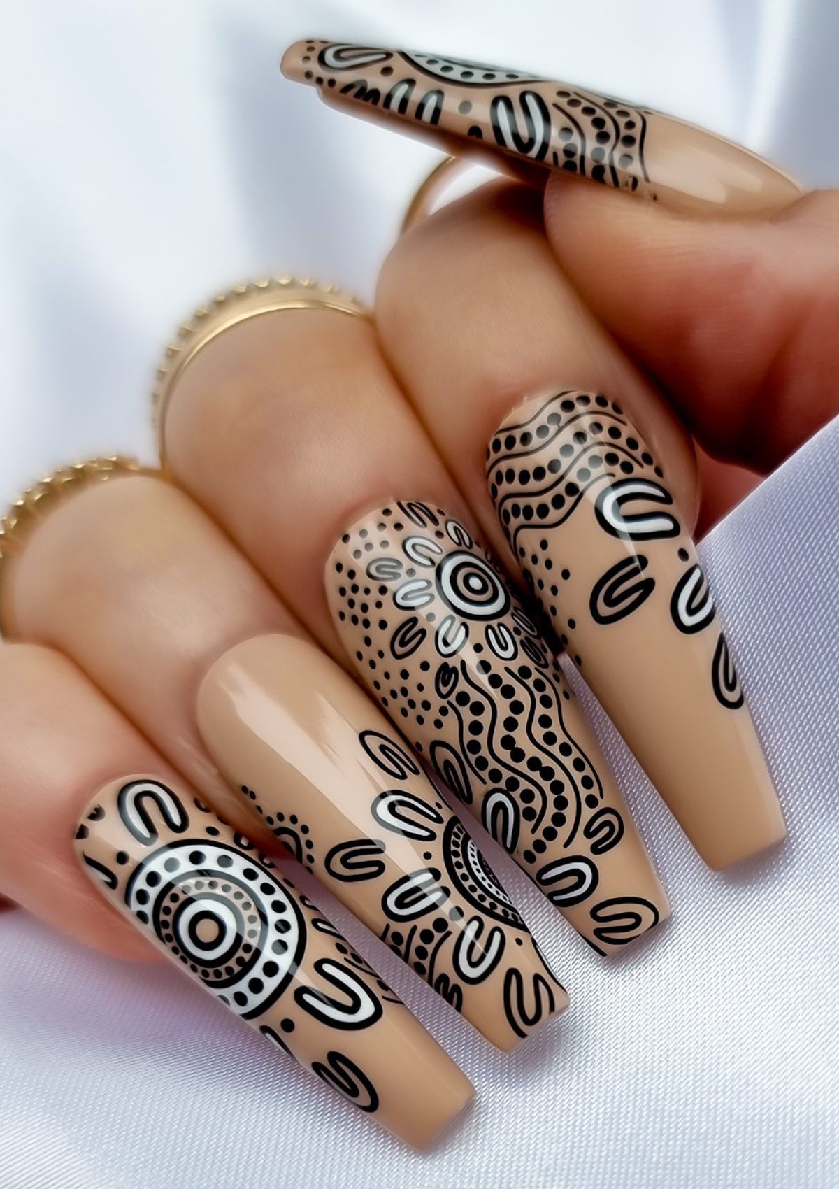 Nude nail with black and white Aboriginal Australian nail art designs
