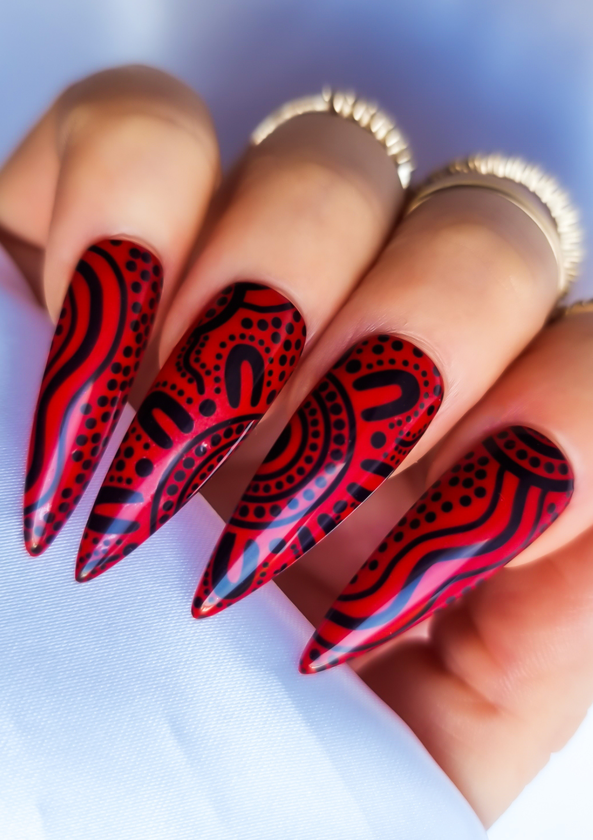 Red nail with black Aboriginal Australian nail art designs