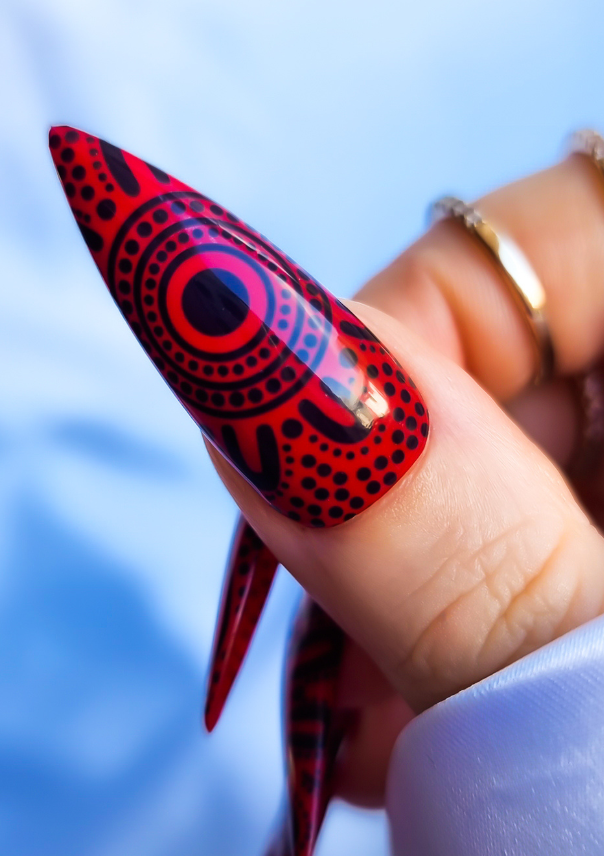 Red nail with black Aboriginal Australian nail art designs