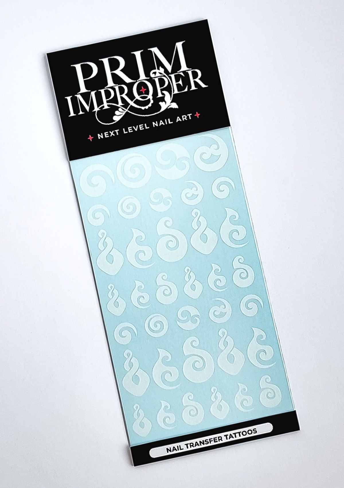 White Maori nail decals with pikorua, hei matau and koru shapes