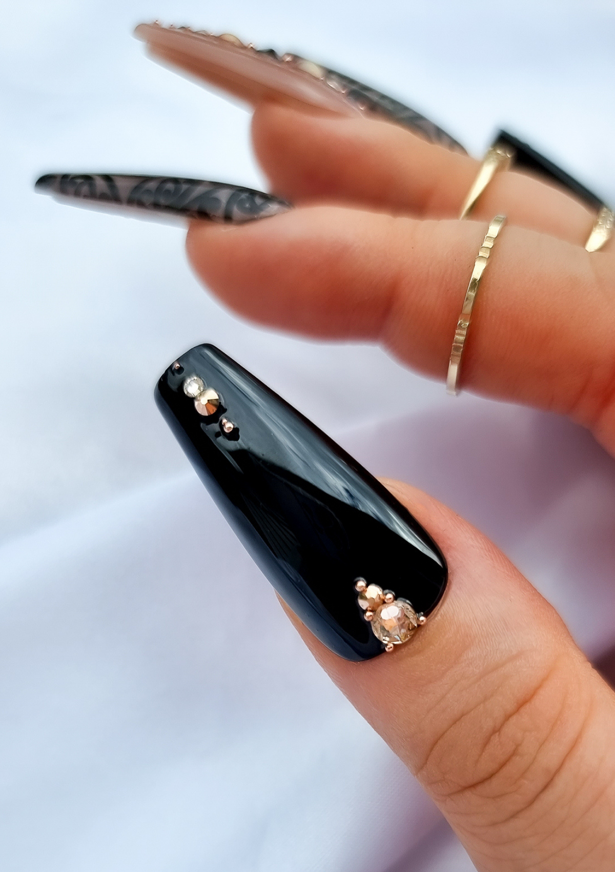 Black thumb nail with Swarovski crystals 